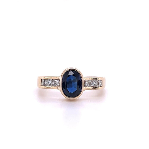 1.48 Carat Oval Cut Blue Sapphire With Princess Cut Diamond Ring in 18k Gold