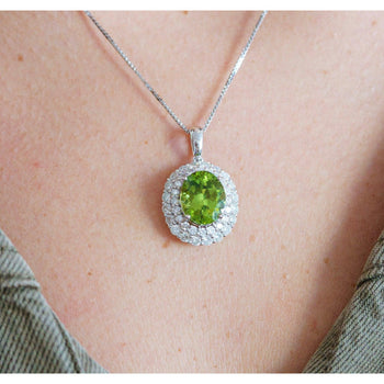 5.03 Carat Oval Cut Peridot Pendant with Round Cut Diamond Halo in 18K White Gold – Assay Jewelers
