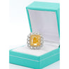 7 Carat Fancy Intense Yellow Radiant Cut Diamond and Diamond Halo Ring | GIA Certified