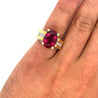 GIA Certified Oval Cut 7 Carat Purplish Red Tourmaline Ring with Diamond Sides in 18K Gold