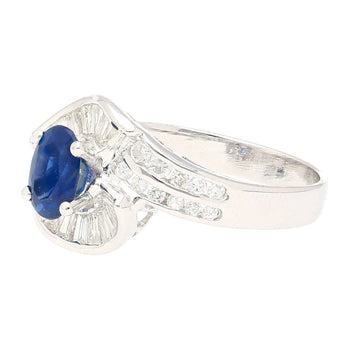 Natural 1.14 Carat Oval Cut Blue Sapphire with Round & Baguette Cut Diamonds in a Swirled 18K White Gold Ring Setting – Assay Jewelers