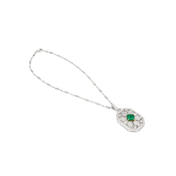 Vintage Carved Platinum 3.16 Carat Vivid Green Minor Oil Emerald Pendant with 4 CTTW in Diamonds